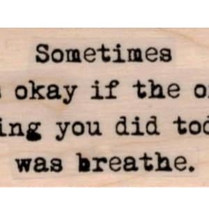 May include: A wooden sign with the text "Sometimes it's okay if the only thing you did today was breathe."