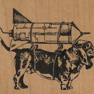 May include: A black and white illustration of a basset hound wearing goggles and carrying a rocket on its back.