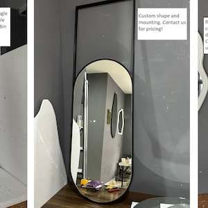 K&ouml;nnte beinhalten: Drei verschiedene Arten von Wandspiegeln. Der erste ist ein rechteckiger Spiegel mit einem anthrazitfarbenen Rahmen und einer Einzelstangenmontage. Der zweite ist ein ovaler Spiegel mit einem schwarzen Rahmen. Der dritte ist ein rechteckiger Spiegel mit abgerundeten Ecken und einer Chromoberfl&auml;che.