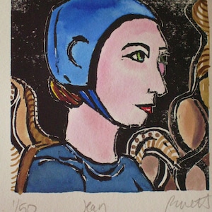 May include: A colorful woodcut print of a person wearing a blue cap with a brown background. The print is signed "Jean" and numbered "1/150".