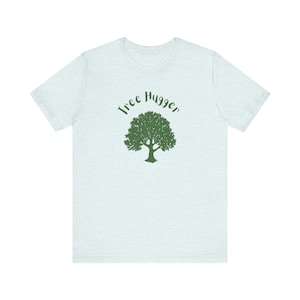 May include: A light blue t-shirt with a green tree and the text "Tree Hugger" printed on the front.
