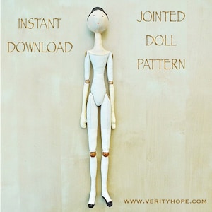 May include: A white fabric doll with brown painted details, including a face, arms, and legs. The doll is jointed at the shoulders, elbows, hips, and knees. The doll is standing on a light wood surface. The text "INSTANT DOWNLOAD" is in the top left corner of the image. The text "JOINTED DOLL PATTERN" is in the top right corner of the image. The text "www.verityhope.com" is in the bottom right corner of the image.