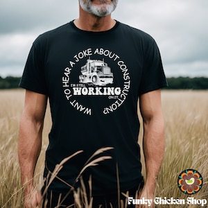 May include: A black t-shirt with a white graphic of a dump truck and the text "Want to hear a joke about construction? I'm still working on it."