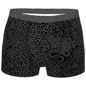 Puede incluir: Calzoncillos tipo bóxer con un patrón de estampado de leopardo en gris oscuro y negro. El diseño incluye ilustraciones detalladas de rosas y serpientes enroscadas integradas en la tela. La prenda tiene una cintura elástica lisa en gris oscuro.
