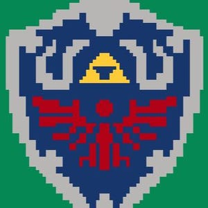 May include: A pixelated image of the Hylian Shield from the Legend of Zelda video game series. The shield is blue with a red Triforce symbol and a yellow triangle in the center.