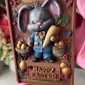 May include: A set of three ceramic mugs with a speckled, matte finish. The mugs are in shades of cream, light gray, and dark gray. Each mug has a simple, minimalist design, perfect for coffee or tea.