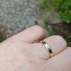 3mm gold ring shown on hand.