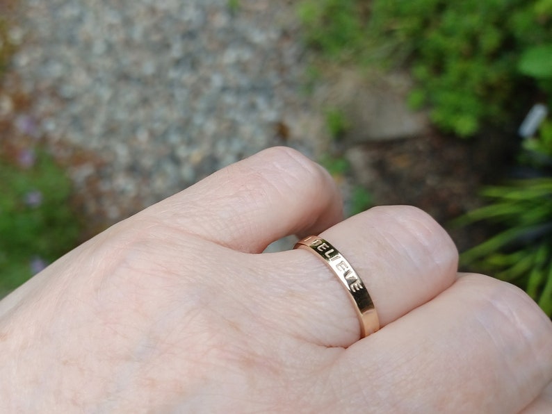 3mm gold ring shown on hand.
