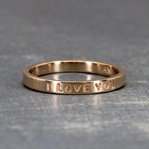 Customized inscription on gold ring. This example shows a ring with the inscription I love you.