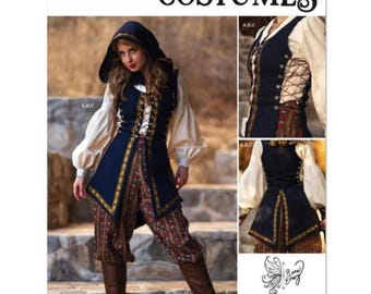 May include: Simplicity S3189 sewing pattern for costumes featuring a hooded vest, long-sleeved cream shirt, and patterned trousers. The navy blue vest has side lacing and gold trim. Includes a QR code for a sew-along video and is designed in the USA.