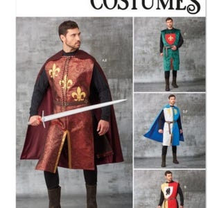 May include: Simplicity Costumes pattern S9775 features sewing instructions for medieval-style tunics and capes. The designs include a red tunic with gold fleur-de-lis, a green tunic with a red shield, a blue and white split tunic, and a red and yellow tunic.