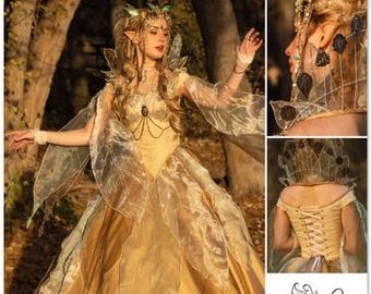 May include: Simplicity Costumes pattern S3160. A golden yellow fairy costume with sheer, leaf-shaped accents. The image includes close-ups of the costume's details, such as the bodice and headpiece. The pattern is designed and printed in the USA.