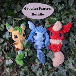 May include: Crochet pattern bundle featuring three amigurumi plushies: a green and yellow Eevee, a blue Espeon, and a red Flareon. The plushies are sitting on a bed of green leaves. The text "Crochet Pattern Bundle" is written in a purple oval above the plushies.
