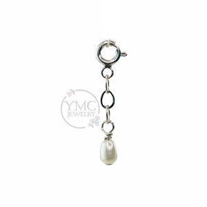 May include: A silver chain with a lobster clasp and a single white pearl pendant.