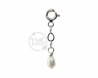May include: A silver chain with a lobster clasp and a single white pearl pendant.