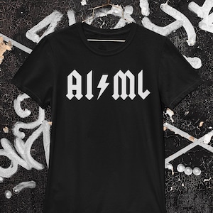 May include: Black t-shirt with a white graphic of the text "AI/ML" in a rock band style font with a lightning bolt.