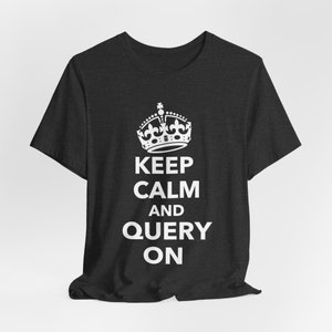May include: A dark gray t-shirt with a white crown and the text "Keep Calm and Query On".