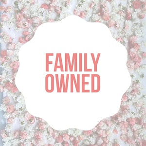May include: White background with a pink, cloud-shaped banner that says "FAMILY OWNED" in pink text. The background is a floral pattern of white and pink flowers.