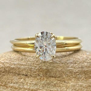 Forever One Oval Moissanite Ring Set with Comfort fit 1.5mm Wide Band, Lifetime Care Plan Included, Genuine Gems and Diamonds LS6886