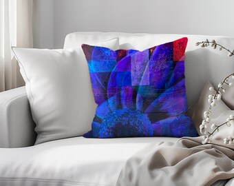 May include: A throw pillow with a close-up image of a blue and purple flower with a red and blue background.