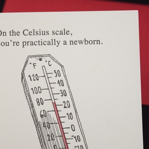 May include: A white card with black text that reads "On the Celsius scale, you're practically a newborn."  A black and white illustration of a thermometer with a red line at 20 degrees Celsius.