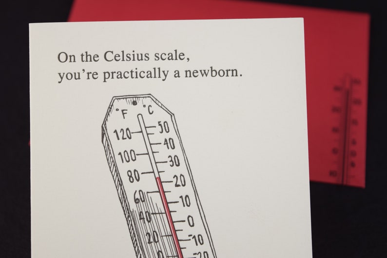 May include: A white card with black text that reads "On the Celsius scale, you're practically a newborn."  A black and white illustration of a thermometer with a red line at 20 degrees Celsius.