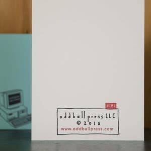 May include: A white card with black text that reads "odd ball press LLC &copy; 2015 www.oddballpress.com" and "#181" in red text.