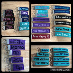 May include: A collage of colorful keychains with embroidered names and text. The keychains are made of fabric and have silver metal rings. Some of the keychains have text like "Fergie 80 Heavy", "Momo Stable Blanket", "Pasa Heavy 72", "Layla 72" Fleece Sheet", and "Pilot Heavy".