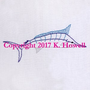 May include: Embroidered image of a blue marlin fish with a white background. The text "Copyright 2017 K. Howell" is visible below the fish.