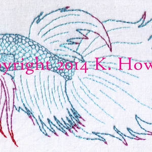 May include: Embroidered image of a blue and red betta fish with the text "Copyright 2014 K. Howell".