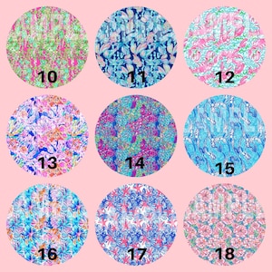 May include: Nine circular fabric swatches with vibrant floral and aquatic patterns. Each swatch is numbered from 10 to 18. The designs feature flowers, leaves, and mermaid motifs in pink, blue, and green hues.