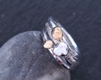 Pebbles Ring. 14 K Solid Rose Gold, Yellow Gold and Sterling Silver Pebbles on three different Sterling Silver stacking rings.