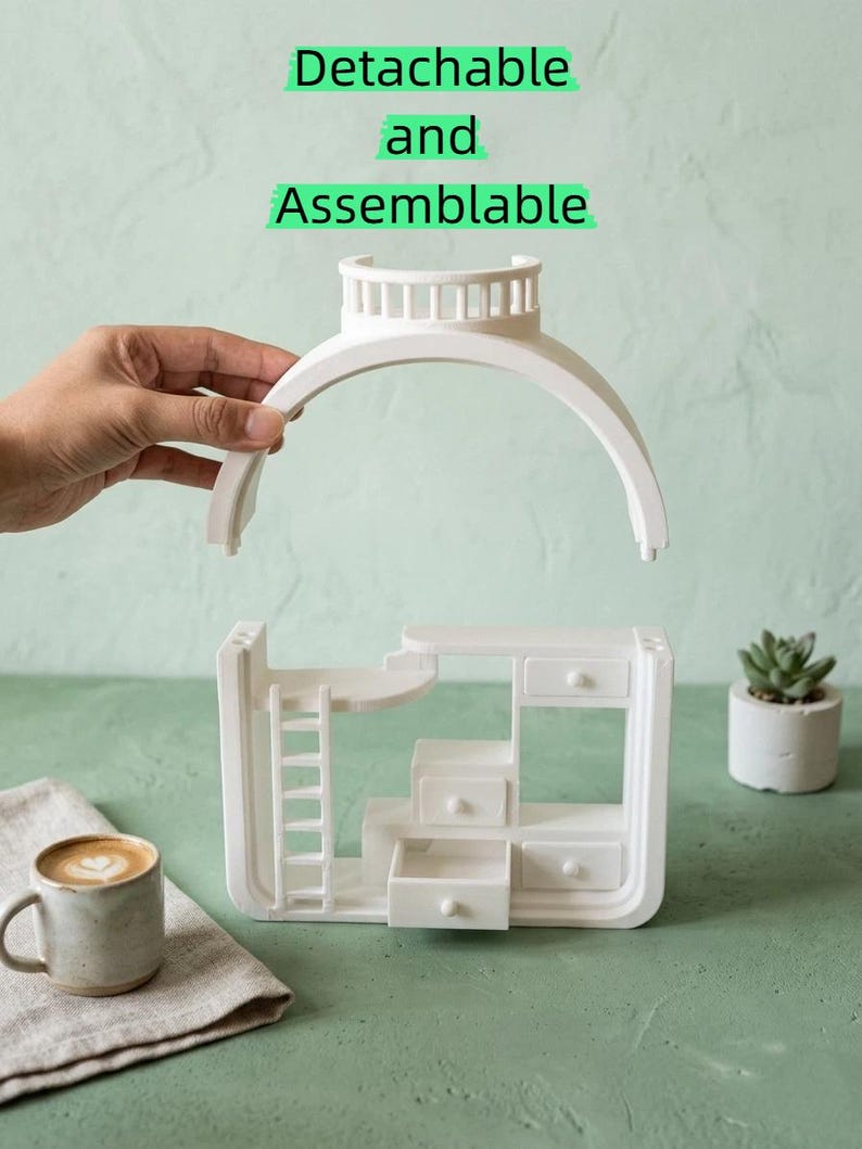 May include: White, detachable and assemblable miniature dollhouse furniture set with a ladder, drawers, and a curved top. The text "Detachable and Assemblable" is displayed above the furniture. A cup of coffee and a small succulent are also in the image.