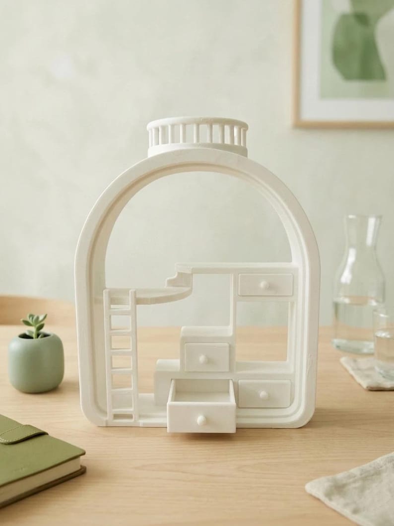 May include: A white decorative miniature dollhouse with a bottle-shaped frame. The interior features a bunk bed, drawers, and a ladder. The design is minimalist and modern, suitable for home decor.
