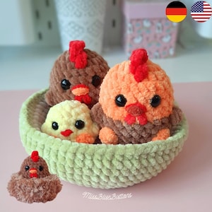 May include: A handmade crochet basket holds three plush chickens in shades of brown, orange, and yellow. Each chicken has black eyes and a red comb. A smaller chicken sits in front. The basket is light green.