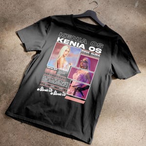 Può includere: Maglietta nera con un design grafico che presenta una donna con i capelli biondi e il testo "Kenia OS Pink Aura Since 2022".