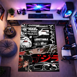 May include: A rectangular area rug featuring a black and white graphic design with Japanese text, stylized illustrations of sports cars, and a manga-style character face. The rug includes logos for Toyo Tires, Sparco, and Liberty Walk.