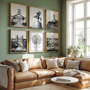 May include: A living room features a tan leather sectional sofa, a white coffee table, and a gallery wall of framed black and white prints. The prints depict architectural landmarks and a map of Tallahassee.