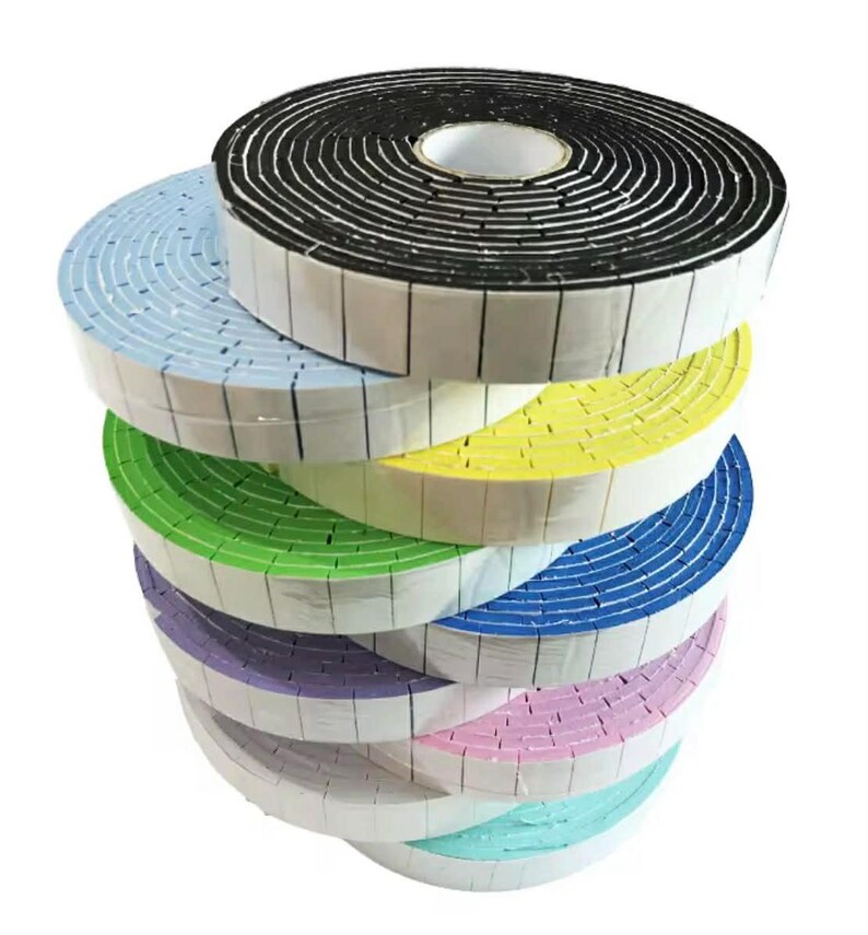 May include: A stack of colorful foam tape rolls. The rolls are in various colors, including black, blue, yellow, green, purple, pink, and teal. Each roll has a white adhesive strip along the edge. The tape is likely used for sealing or insulation purposes.