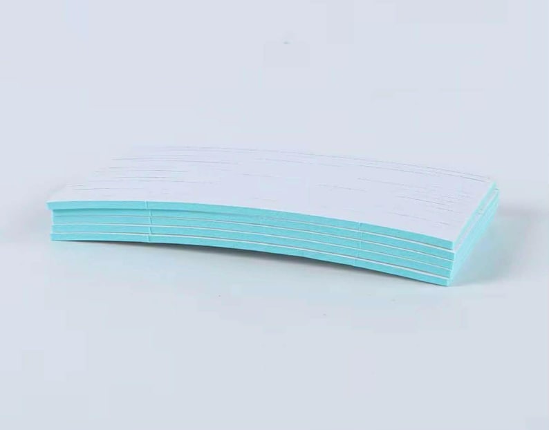 May include: A stack of white paper sheets with light blue edges, slightly curved. The paper is neatly stacked, creating a clean and organized appearance. The background is a solid, light blue color.