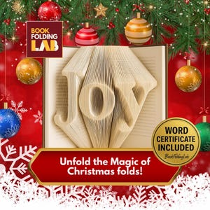 May include: A book with the word "JOY" folded into the pages, surrounded by Christmas ornaments and greenery. The image includes the text "Unfold the Magic of Christmas folds!" and "WORD CERTIFICATE INCLUDED".