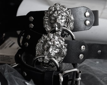 LION'S HEAD BRACELETS: Black leather cuff with lion head detail