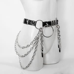 CALIGULA BELT: Pvc vinyl belt with big O-rings, chains and crystals