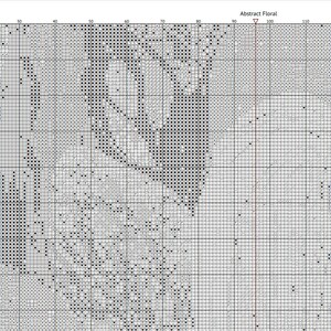 May include: Black and white cross stitch pattern featuring a floral design. The pattern is displayed on a grid with black squares indicating stitches.