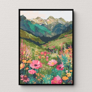May include: A colourful painting of a mountain landscape with a field of pink, yellow and orange flowers in the foreground.