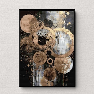 Puede incluir: Impresión de arte abstracto con círculos superpuestos en tonos de marrón, dorado y negro sobre un fondo blanco y gris.