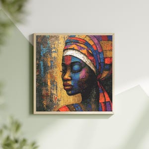 Puede incluir: Una obra de arte enmarcada que presenta un retrato de una persona con los ojos cerrados, con un colorido pañuelo en la cabeza. La obra utiliza una paleta de azules, rojos, amarillos y morados. El fondo tiene un diseño abstracto texturizado.