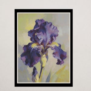 May include: A framed wall art print featuring a detailed painting of a single purple iris flower in full bloom. The flower displays deep violet petals with yellow accents at the centre, set against a soft, muted yellow and light green background.