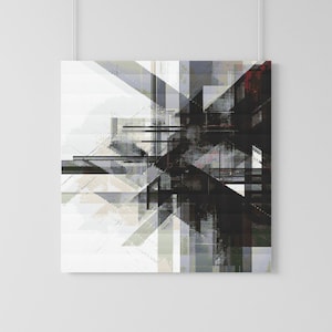May include: Abstract geometric art print featuring a complex arrangement of shapes and lines in shades of gray, black, and white. The artwork has a textured appearance, with a mix of sharp angles and softer, blended areas. The print is displayed on a white wall.