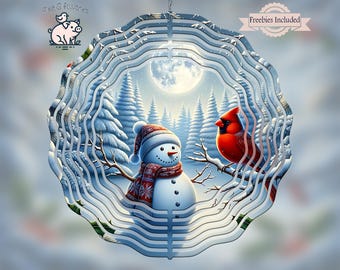 May include: A layered metal winter scene decoration featuring a snowman with a red scarf and hat, and a red cardinal bird perched on a branch. The background shows a snowy forest and a full moon. The text "Freebies Included" is visible.